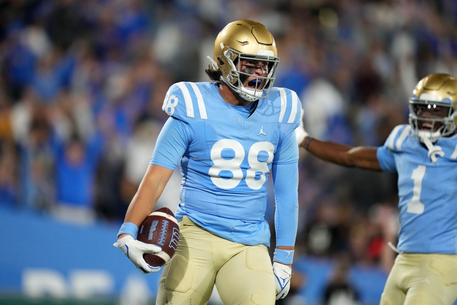 UCLA Bruins tight end Moliki Matavao celebrates after a touchdown.